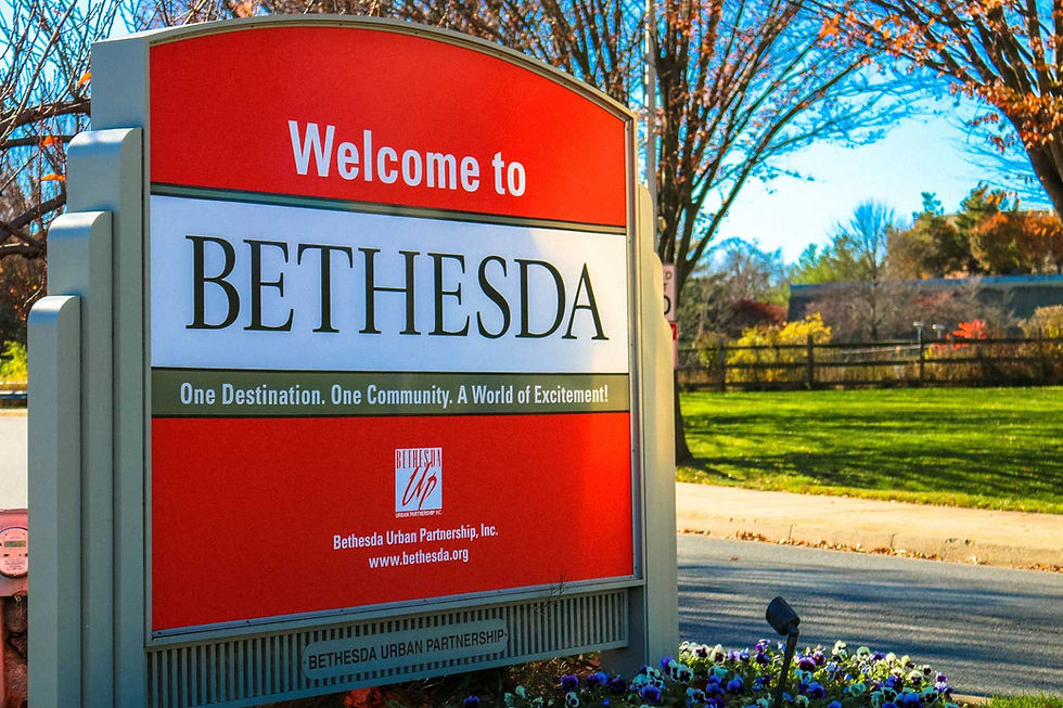 A sign that reads "Welcome to Bethesda. One Destination. One Community. A World of Excitement!"