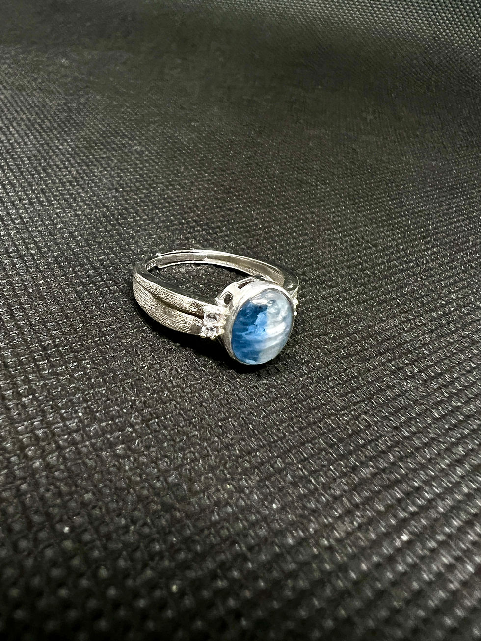 Eye-level view of a designer showcasing unique jewelry pieces