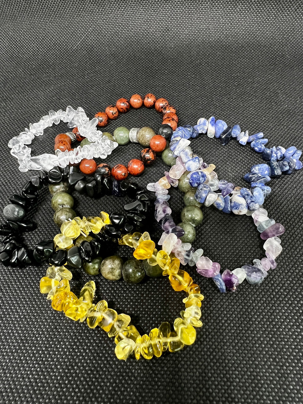 High angle view of colorful resin bracelets on a wooden table