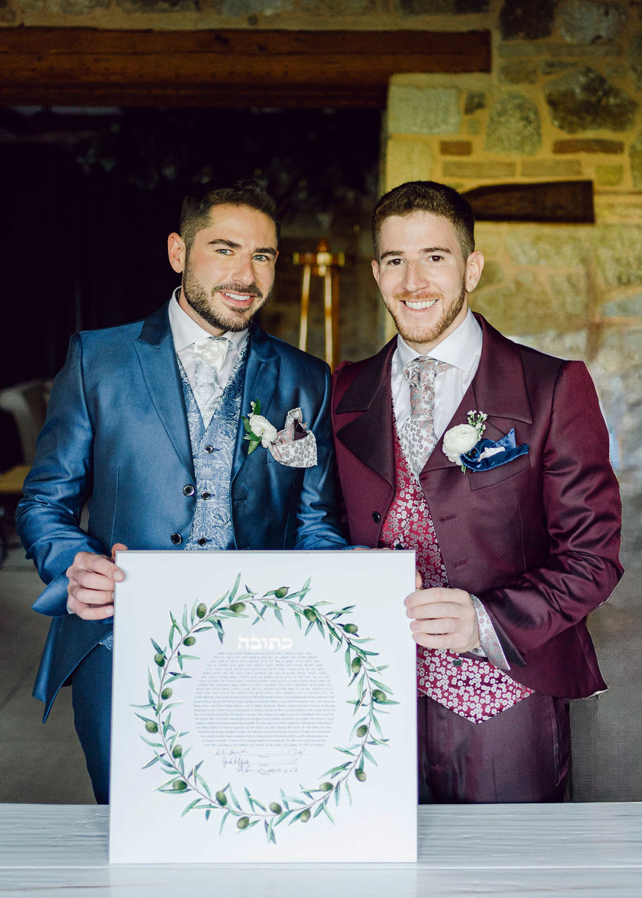 Thumbnail: Couple under chuppah with modern watercolor ketubah