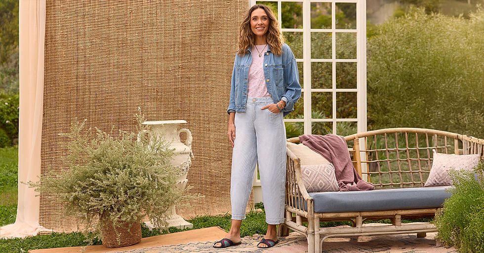 Woman in chambray shirt and wide-leg crop pants on patio by Democracy Clothing