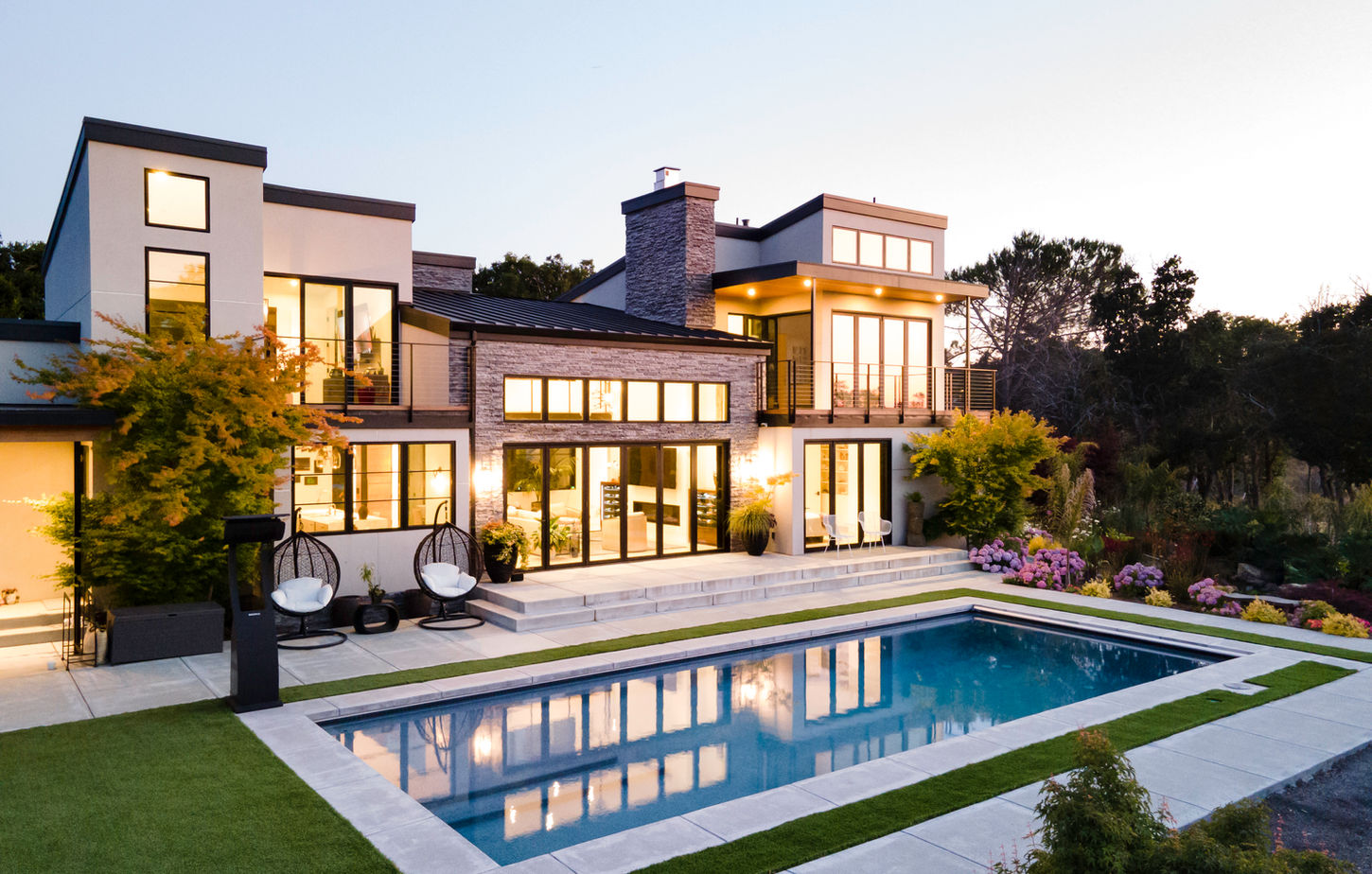 Integrated luxury Design-Build estate project featuring custom architecture by G Design, general contracting by G Family Construction, and premium site work by G Landscape Division.