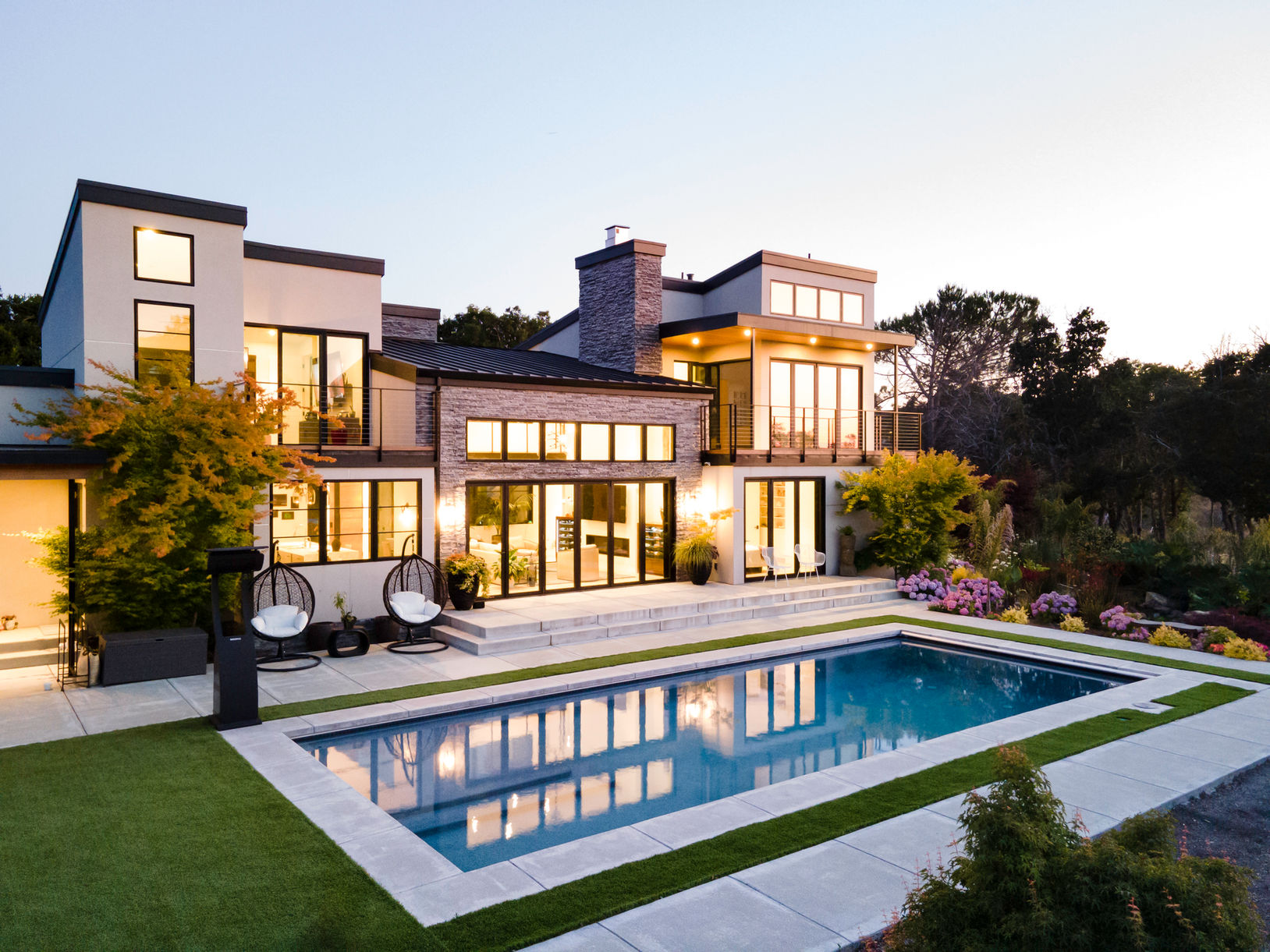 Integrated luxury Design-Build estate project featuring custom architecture by G Design, general contracting by G Family Construction, and premium site work by G Landscape Division.