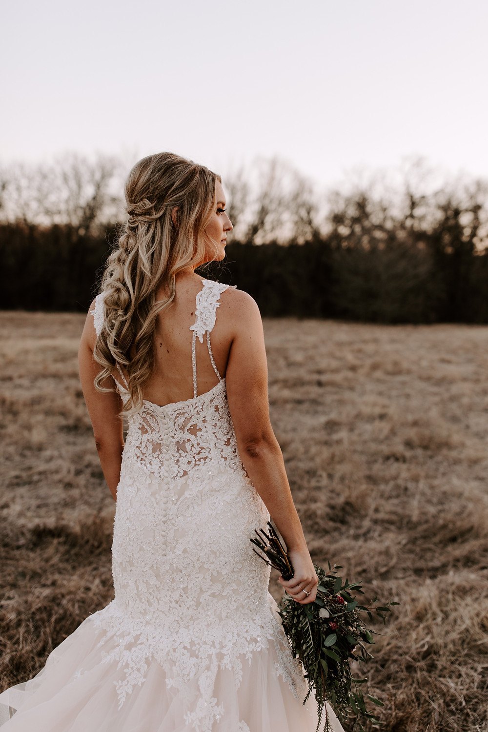 wedding dress with greenery and leaf bouquet