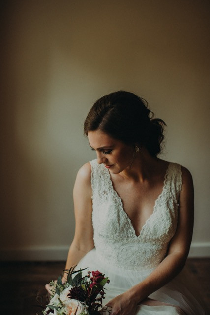 beautiful bridal portrait with ivory and burgundy bouquet