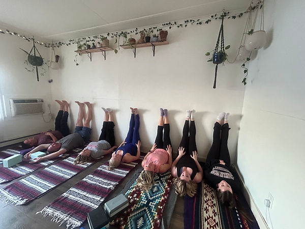 legs up team at yoga.jpeg