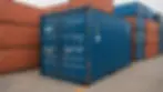 Eye-level view of a shipping container at a port