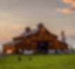 Wedding guests socializing in front of rustic , elegant barn at a Gunnison wedding venue on the western slope of colorado