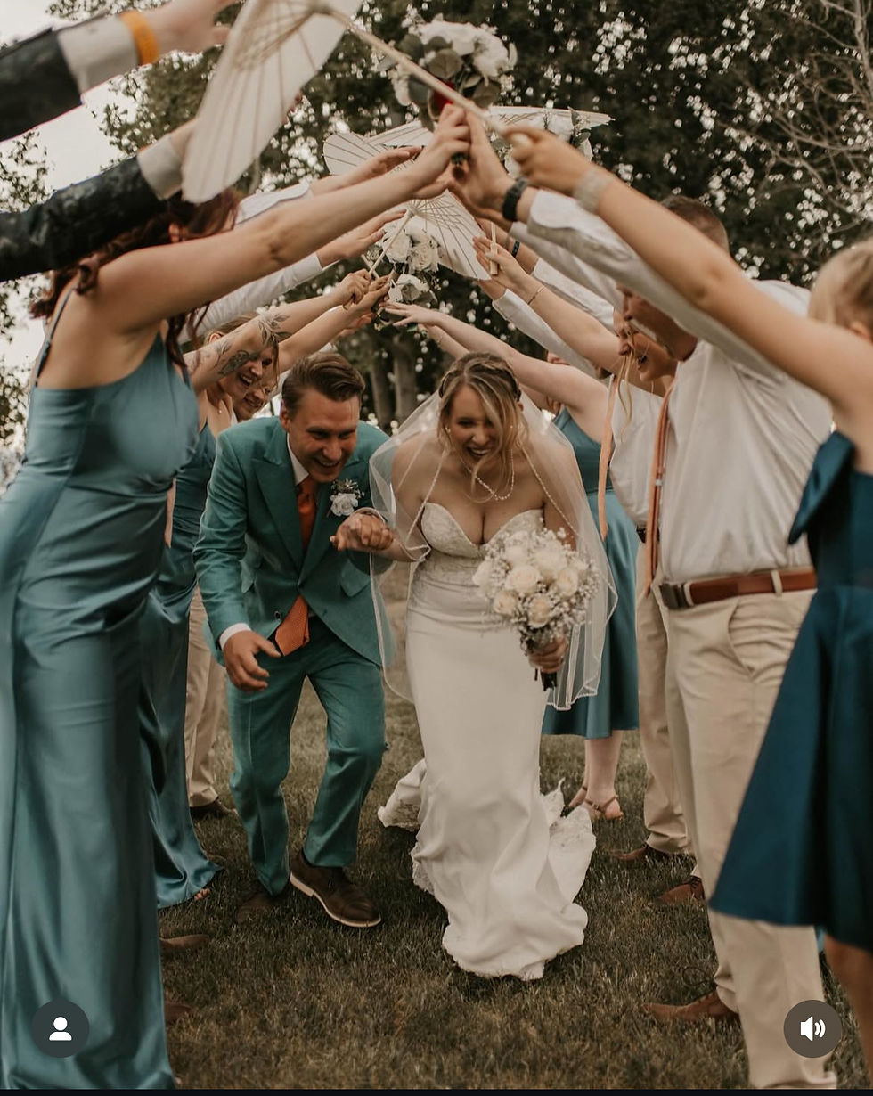 Bride and Groom celebrating their destination wedding at a Western Slope barn wedding venue in Montrose, Colorado