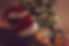 Newly engaged couple at antler ridge Weddings wearing Santa hats, chriistmas tree,  Christmas lights