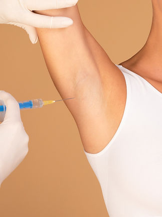 hyperhidrosis-treatment-young-lady-receiving-underarm-shot-prevent-excessive-sweating-crop