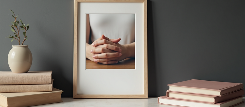 Framed photo of hands over heart on a quiet table, symbolising emotional safety and clarity after collapse