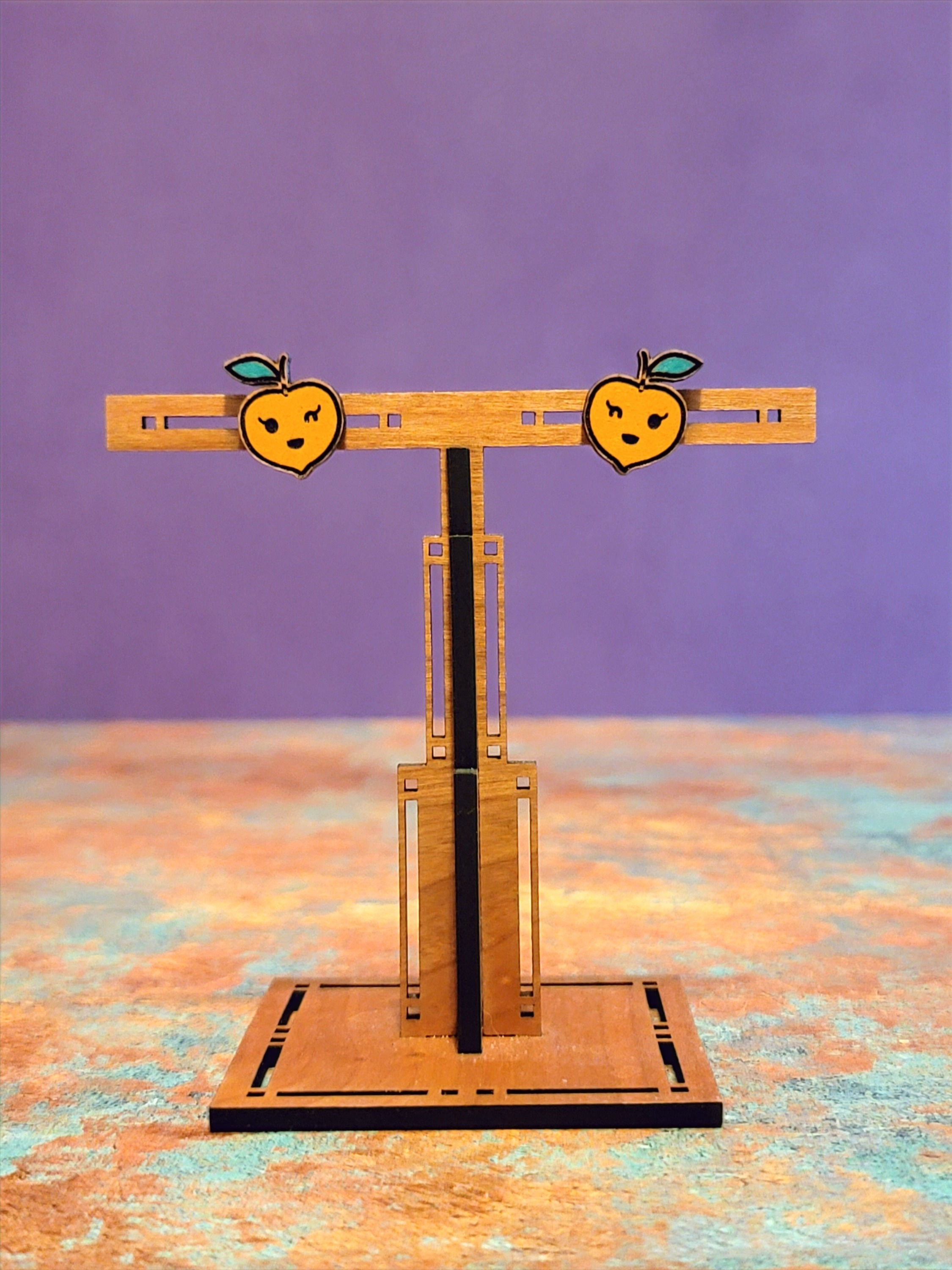 Winky peach stud earrings
