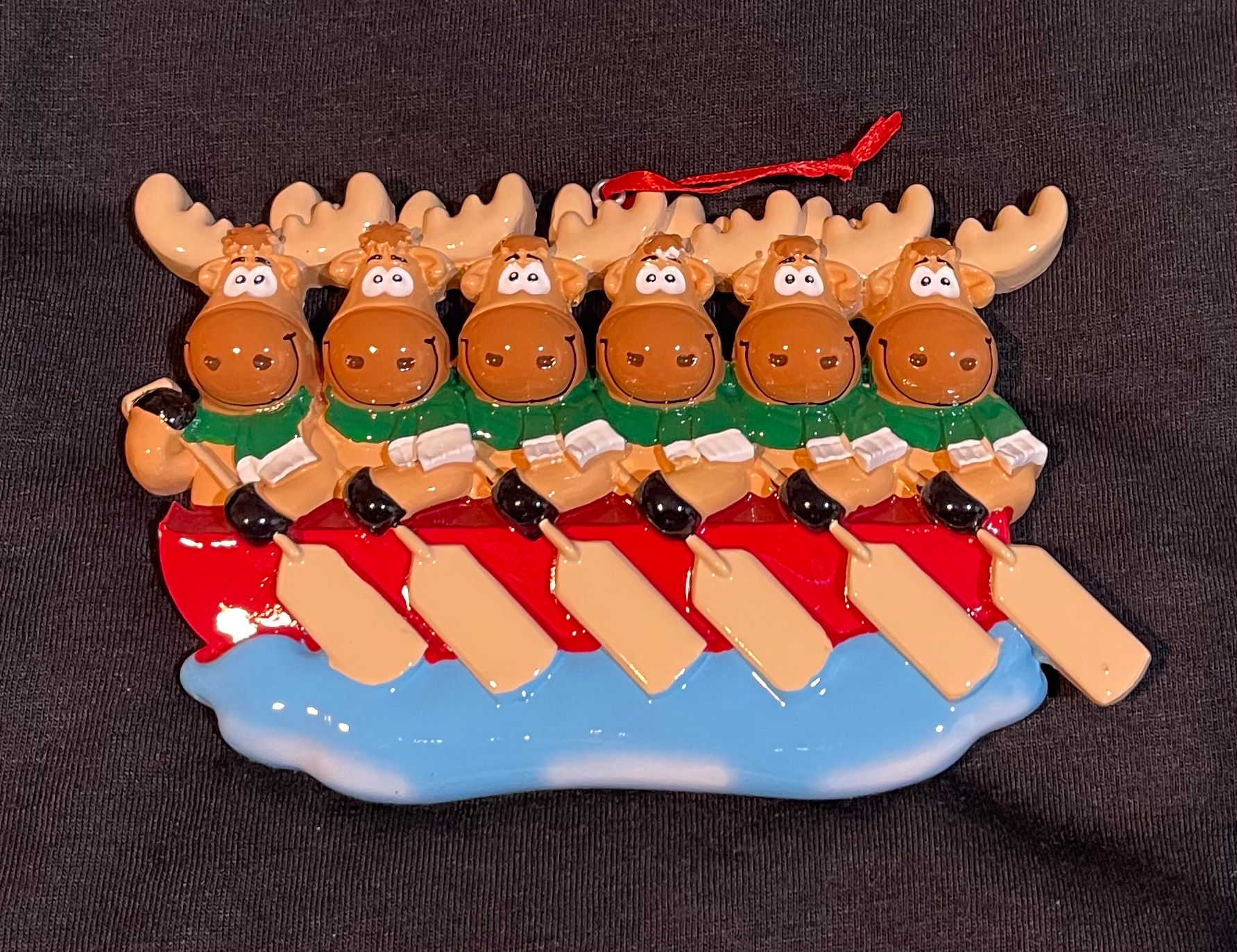 FAMILY OF 6 MOOSE IN A CANOE