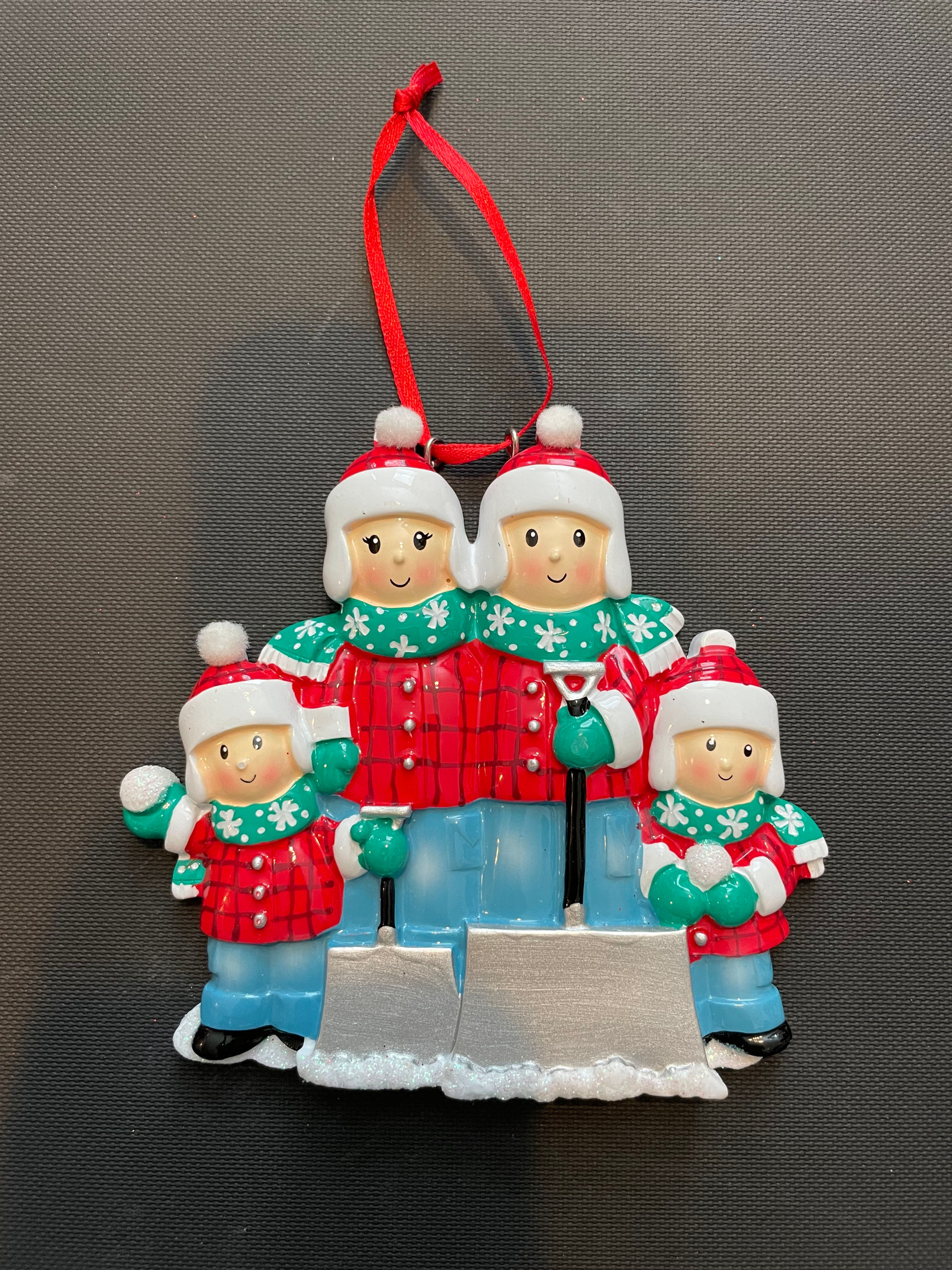 FAMILY OF 4 WITH SHOVELS