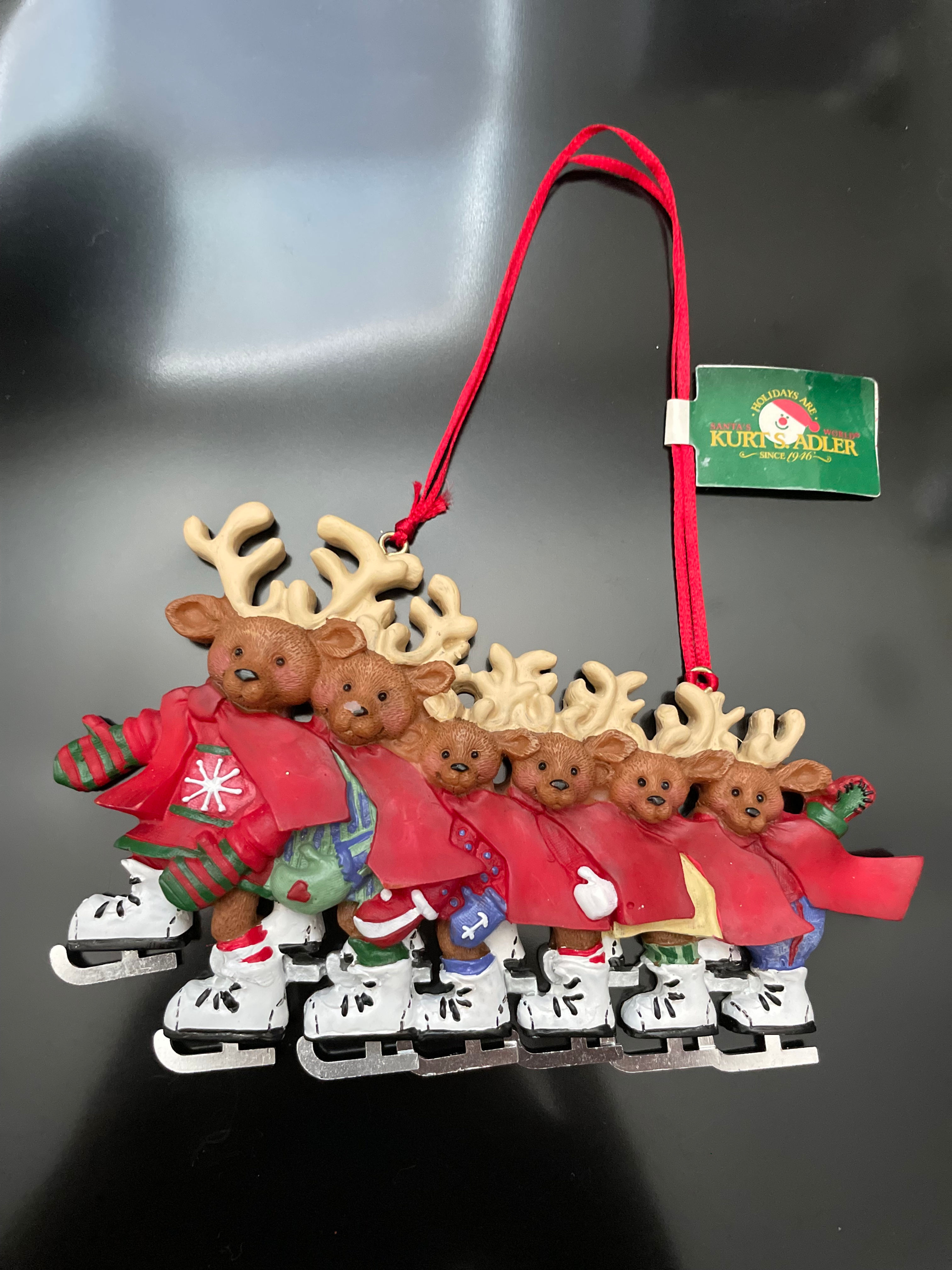 FAMILY OF 6 ICE SKATING DEER