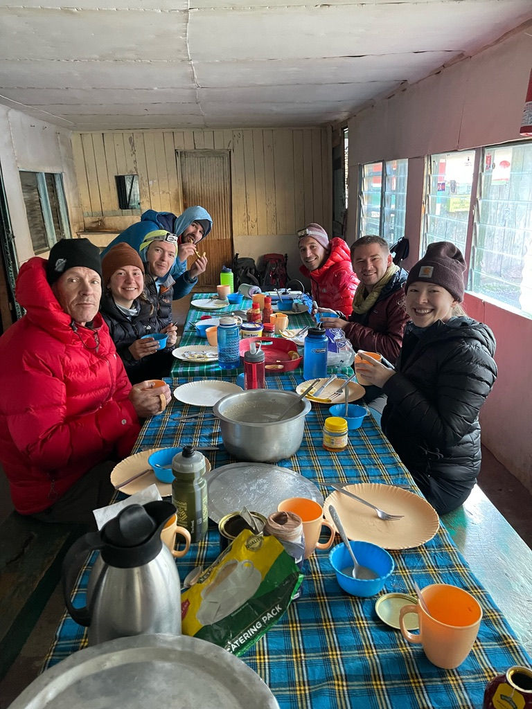 A groggy team breakfast in Shipton hut. While the food wasn't always the best, nothing could more aptly describe the mentality towards meals than "quantity over quality."