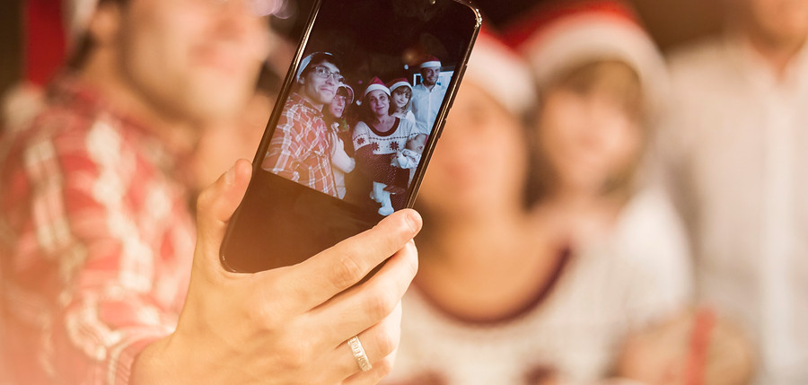 friends-making-selfie-santa-hats.jpg
