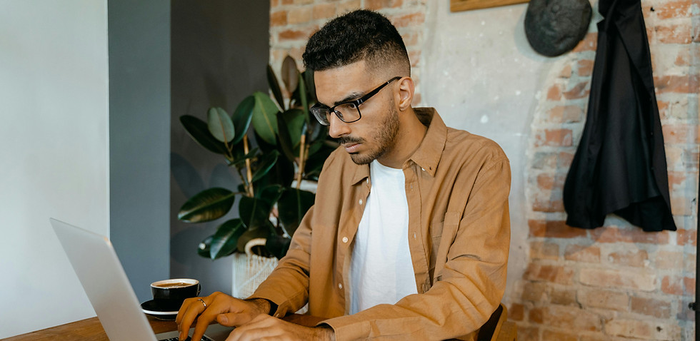 man on laptop, working from hom