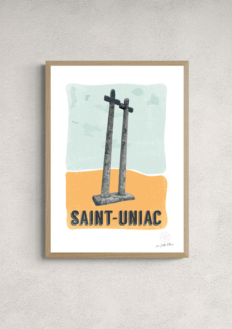 Affiche illustrée "Saint-Uniac" avec ses deux croix de pierre, encadrée en chêne sur un mur texturé
