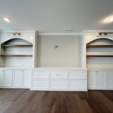 Custom Media Wall with Arched Built-Ins & Wood Shelving