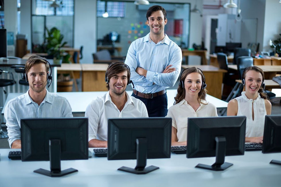 business-executives-with-headsets-using-computer-office