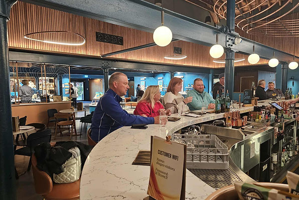 Guests enjoying a cosy whisky tasting at Glen Ord Distillery