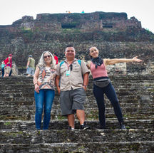 Guide Elio and Guests taking photo on the steps of El Castillo Xunantunich
