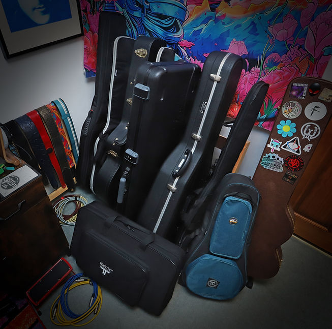 The inside cover of the album Eponymous. It features lots of guitars in their cases stood in a rack.