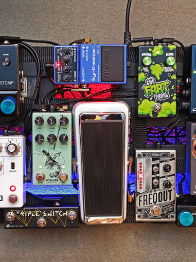 A fairly large guitar pedalboard assembled with the pedals described in the accompanying text.