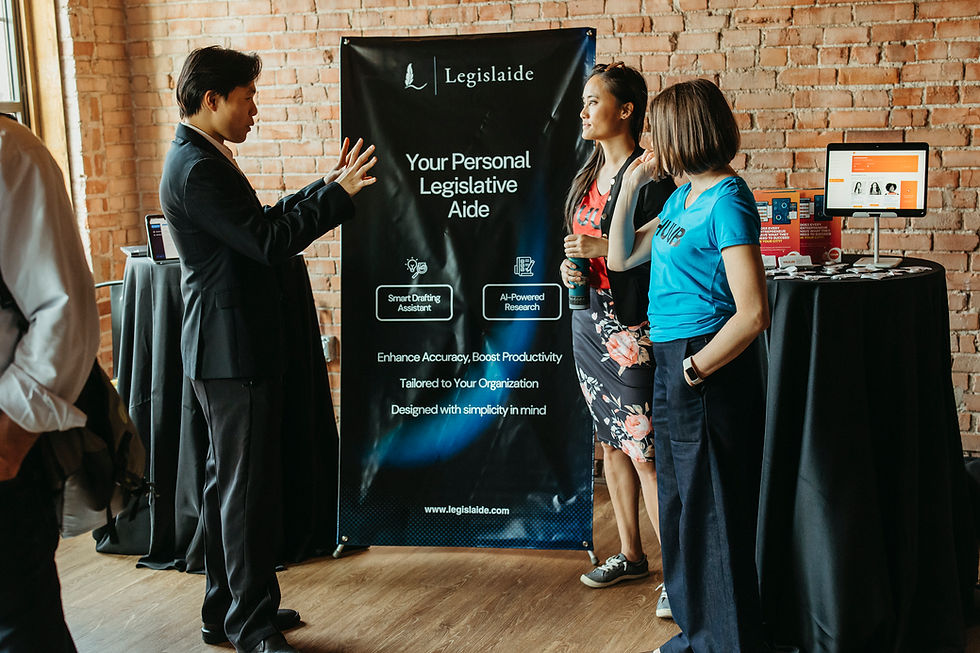A man presenting an idea to two others at a conference