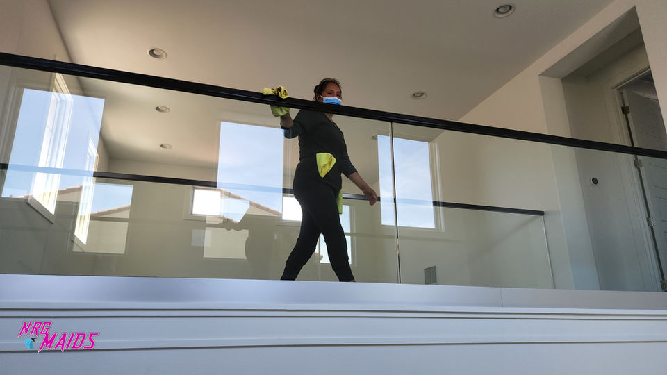 Professional deep cleaning glass railing