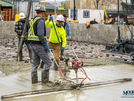Commercial construction crew on site where drawings and field conditions must be verified