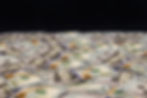a-lot-of-dollar-bills-on-a-black-background-2022-04-27-02-06-54-utc.jpg