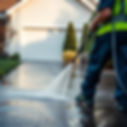 the tip of an active pressurewasher, pressure washing a driveway.jpg