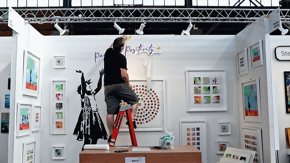 Niall on a ladder setting up his stand / booth for The Other Art Fair, Brooklyn