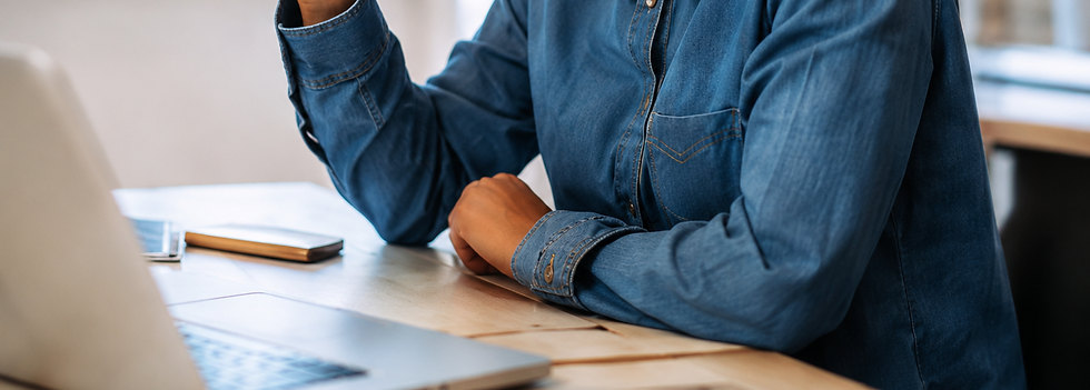 Person completing an online notarization using a laptop