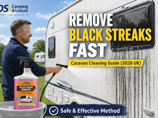 Man cleaning black streaks from a caravan using a hose with Fenwicks Black Streak Remover bottle in bucket – IDS Camping and Leisure cleaning guide