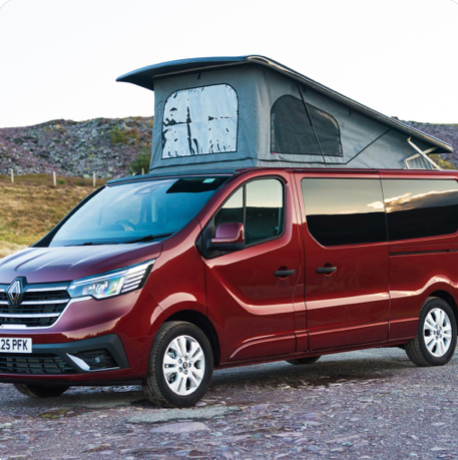 High top campervan conversion with permanent raised roof parked on campsite