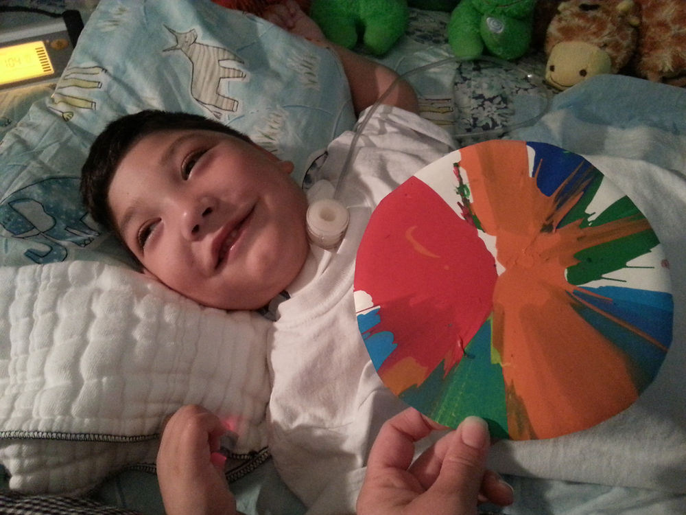 Image of Bret Bigelow smiling with a craft.