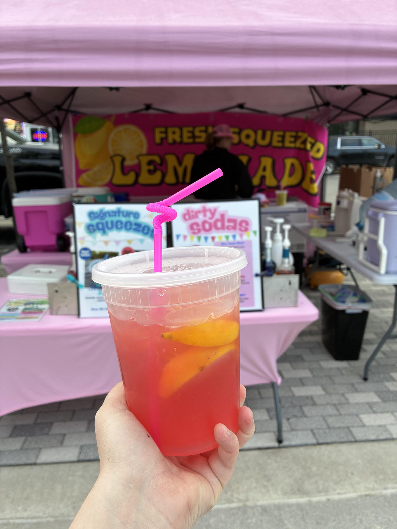 Fresh pink lemonade served in front of the Squeezy Pop pink tent