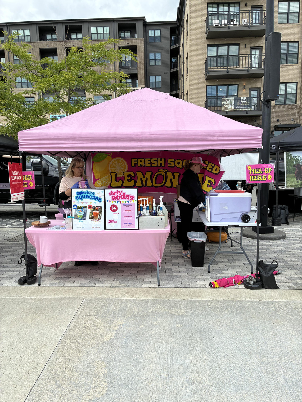 Squeezy Pop mobile pink lemonade tent at an outdoor community event