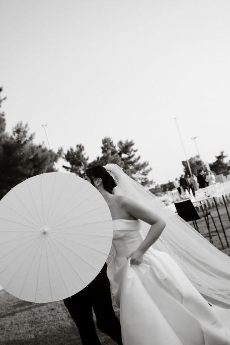 Bride in couture gown in Athens Riviera gadren venue, destination wedding Greece