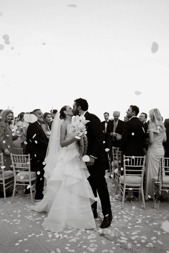 Destination couple celebrating wedding at Lazarou Beach Greece
