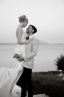 Bride and groom portrait framed by the Athens Riviera coastline