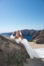 Bride portrait with caldera backdrop in Santorini