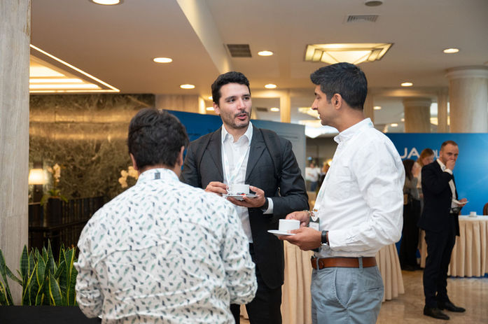 Lifestyle documentary coverage of professionals chatting over coffee at networking lunch