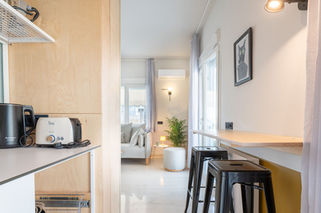 Home office corner setup inside urban Airbnb rental for digital nomads