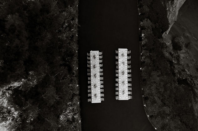 wedding reception tablescape drone shot in green landscape and soft evening light