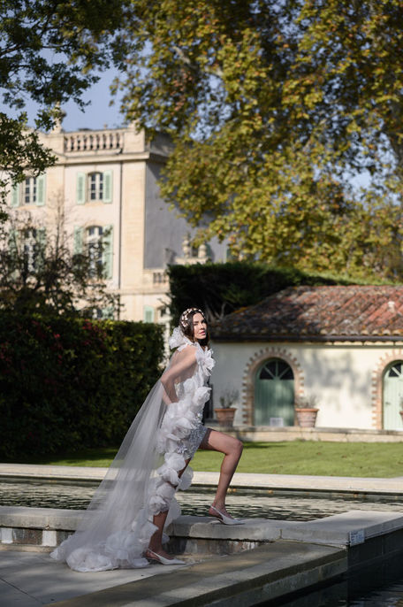 Editorial portrait of the bride framed by historic Château de Tourreau architecture